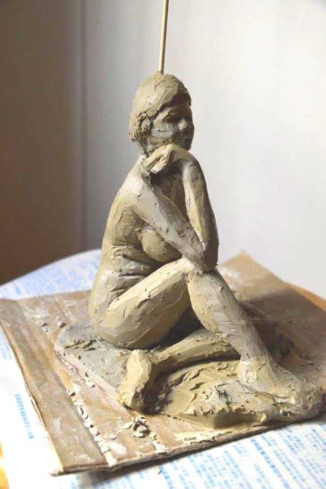 Clay sculpture, sitting pose